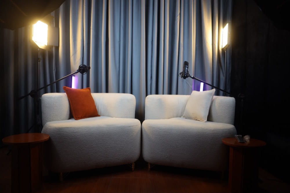 INUES Leads recording studio with podcast seating and professional lighting